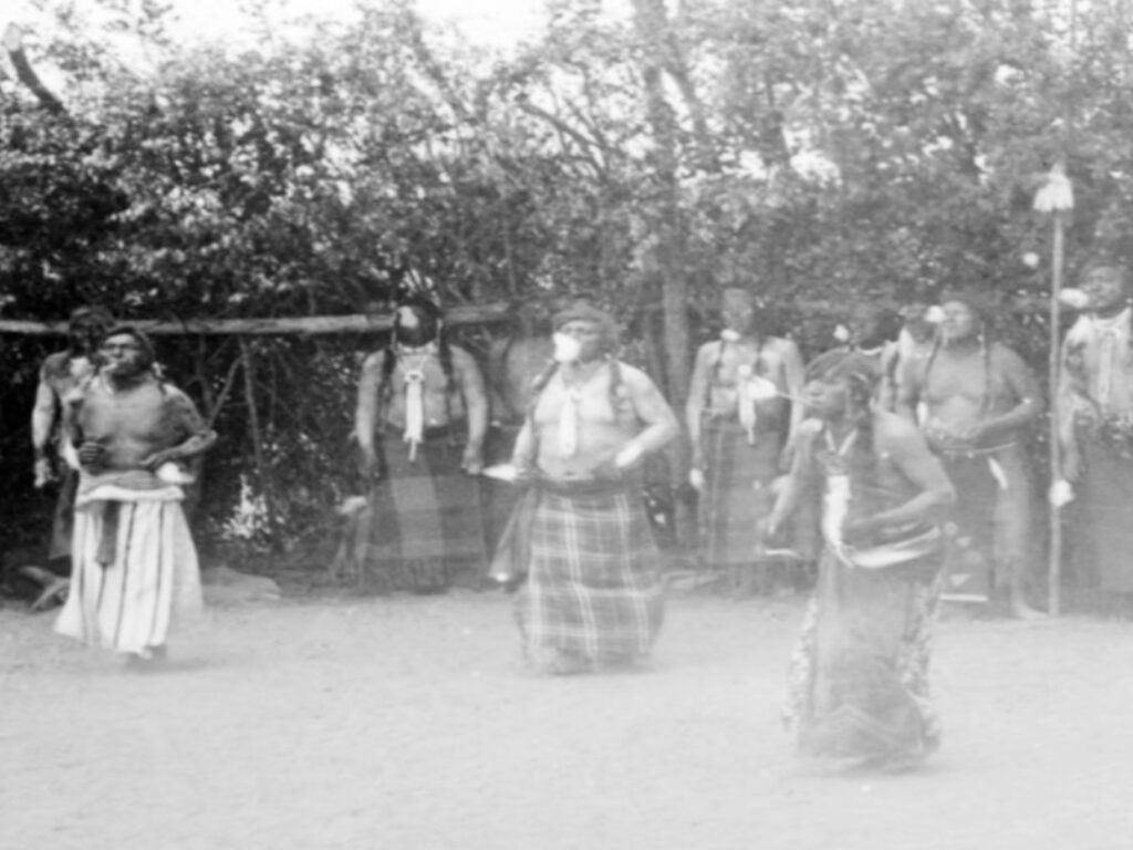 Sioux Sundance Ceremony. A gathering of men in ceremony celebrating the Sundance, which was outlawed and forced into hiding. Today the ceremonies are now welcomed and celebrated every summer across Turtle Island.