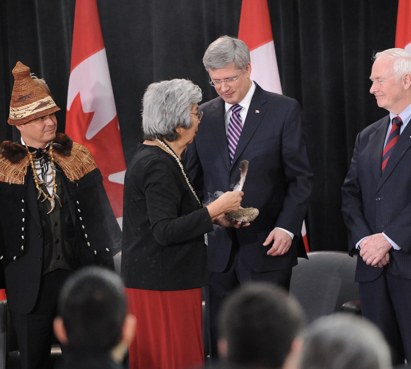 Crown-First Nations Gathering, with the late Elder Bertha Commonda smudging Prime Minister Harper along with National Chief Shawn Atleo and Governor General David Johnston.