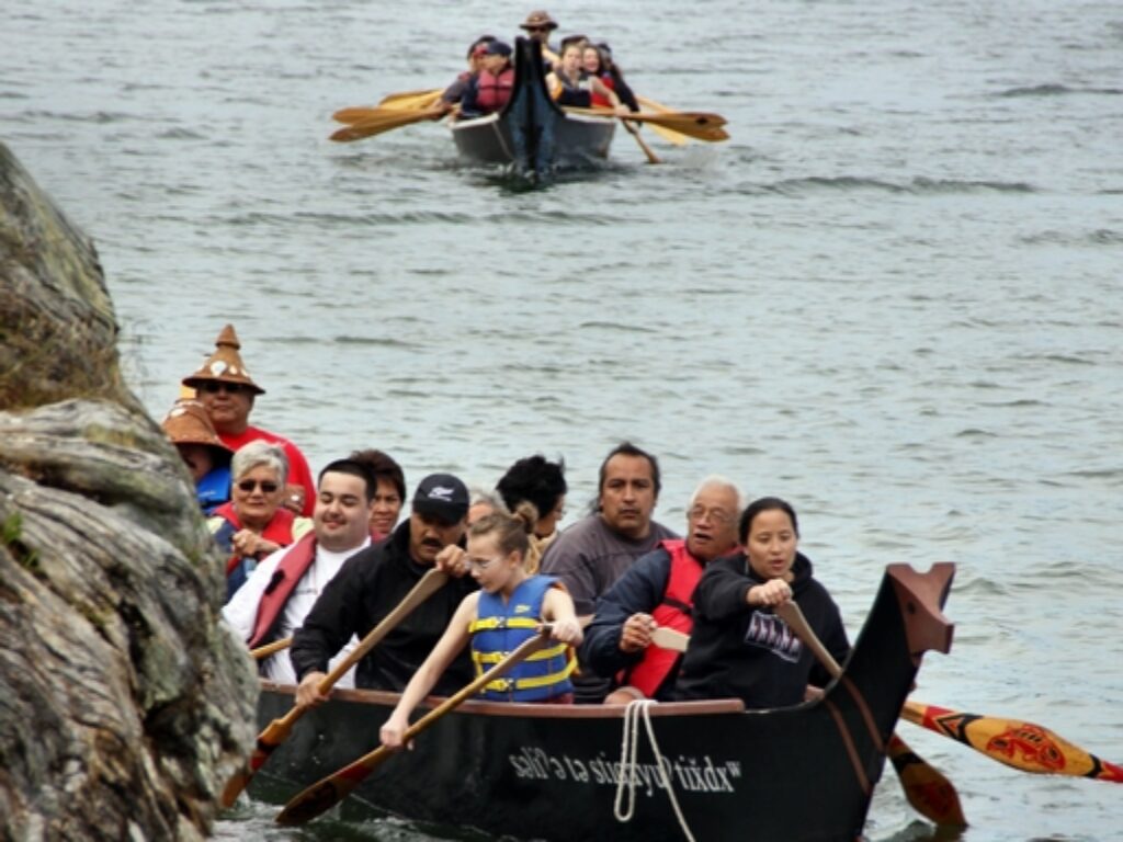 This is one way to arrive at a potlatch - in ceremonial style! Culture is ever evolving. At most First Nations ceremonies and celebrations you will see a mix of traditional and modern influences.